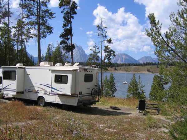 Camper trailer with Jackson Lake and Mount Moran in the distance