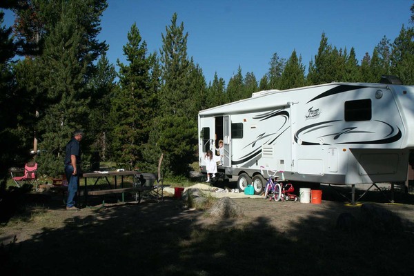 RV and people at a campsite