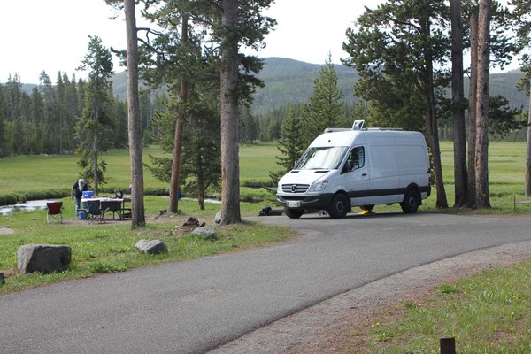 Small RV parked at a campground